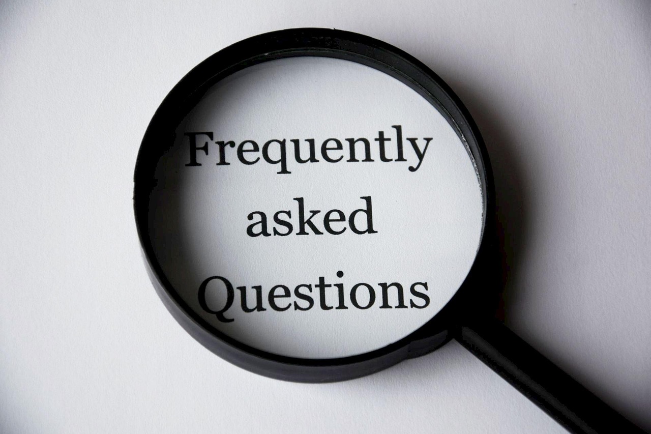 Magnifying glass over FAQ document covering motor vehicle accident questions in South Africa